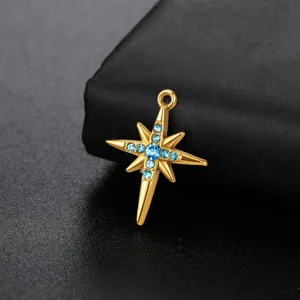 Gold tone stainless steel 8-pointed star pendant detail with sparkling blue rhinestones