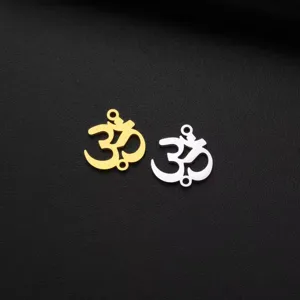 Close-up of gold and silver Om symbol pendants, yoga meditation DIY jewelry making charms.