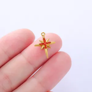 Gold stainless steel North Star pendant with red crystals for DIY handmade jewelry crafts detail.