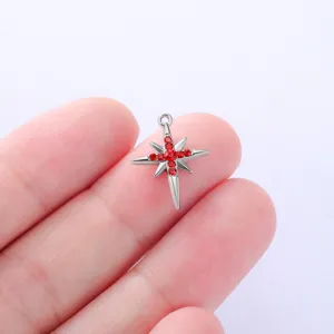 Stainless steel star pendant detail showing sparkling red crystal stones and exquisite shape.