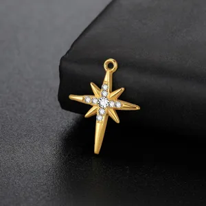 Close-up of gold-plated stainless steel north star pendant detailed with sparkling crystal stones.