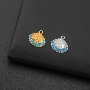 Detailed shot of titanium steel shell pendants with blue rhinestones, perfect for DIY jewelry.