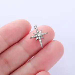 Close up detail of stainless steel north star pendant charm with sparkling cubic zirconia stones.