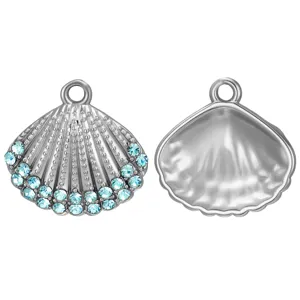 Detailed view of silver shell pendant with blue rhinestones and plain back for DIY jewelry.