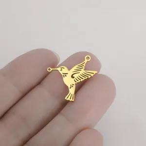 Gold hummingbird double hole pendant detail view, stainless steel DIY jewelry making component.
