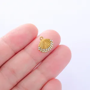Gold seashell charm pendant with sparkling rhinestones for DIY jewelry making crafts detail