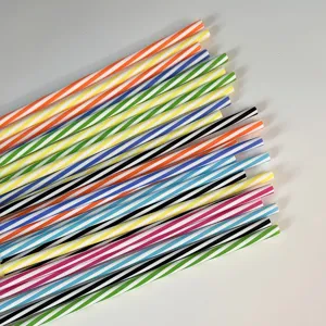 Detail view of colorful striped plastic drinking straws, straight hard reusable design.