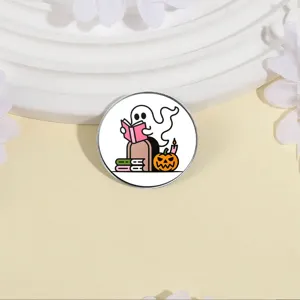 Close-up detail shot of the cute ghost reading a book enamel pin, perfect accessory design.