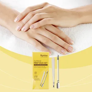 Detailed view of Nymixa professional cuticle prep duo set with stainless steel manicure tools and box.