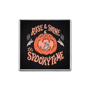 Halloween pumpkin metal brooch detail close up view of gothic style fashion pin badge