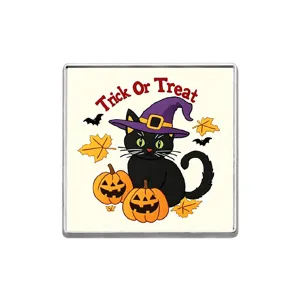 Detailed view of the Halloween black cat and pumpkin brooch showing intricate cartoon badge work.