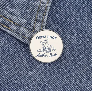 Cute reading duck metal brooch badge, funny English slogan pin for denim jackets and bags.