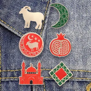 Detail view of retro Arabic style enamel lapel pins featuring geometric motifs, crescent and goat.