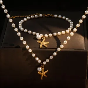 Detailed shot of pearl starfish necklace and bracelet set, perfect beach vacation.