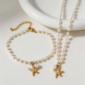 Elegant pearl starfish necklace and bracelet jewelry set for women, perfect for beach vacation.