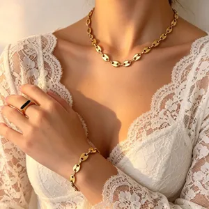 Gold coffee bean link necklace bracelet ring set, elegant titanium steel jewelry detail.