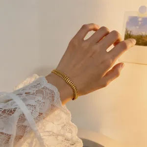 Elegant gold metal chain bracelet for women, stylish daily wear wrist jewelry accessory.