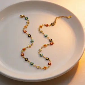 Gold-tone titanium steel necklace featuring vibrant colorful enamel daisy flower pendants for summer wear.