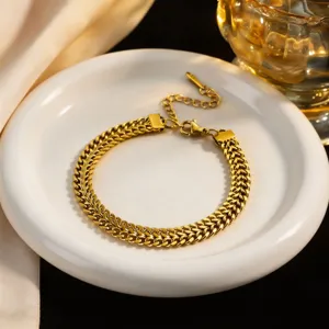 Exquisite gold-tone titanium steel braided chain bracelet, detail view showcasing elegant design.
