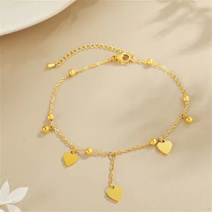 Close-up detail view of the elegant gold titanium steel heart charms anklet accessory.