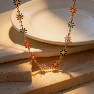 Colorful enamel daisy flower necklace, gold plated steel chain, trendy boho jewelry.