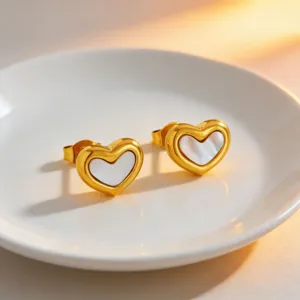 Chic white shell heart stud earrings in gold tone titanium steel, elegant minimalist style.