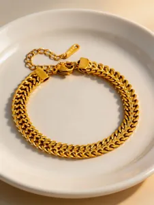 Exquisite gold titanium steel woven chain bracelet detail, elegant and durable fashion.