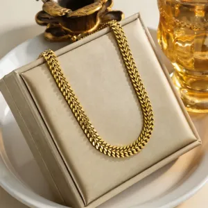 Exquisite gold titanium steel mesh chain necklace, detailed close-up shot showcasing luxury shine.