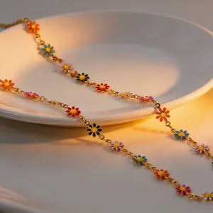 Detailed close-up view of vibrant colorful enamel daisy flower necklace in titanium steel.