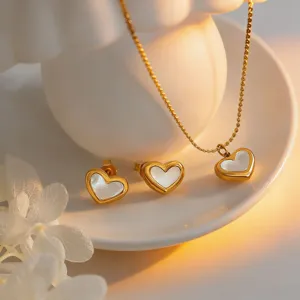 Gold stainless steel heart necklace and earrings set with white mother of pearl detail.