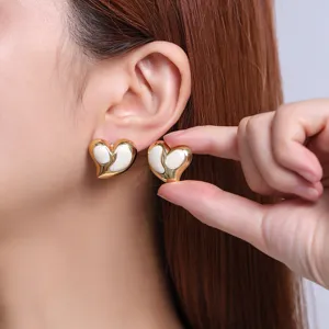 Minimalist French sweet style oil drop heart titanium steel earrings close-up detail display.
