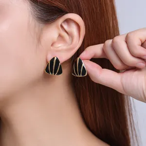 Minimalist geometric triangle drip-oil titanium steel earrings, stylish black and gold detail view.