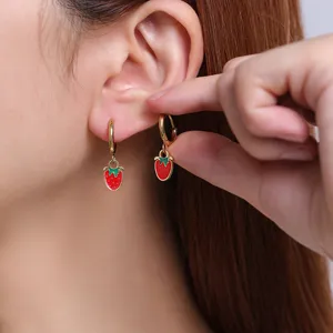 Charming stainless steel hoop earrings featuring cute red strawberry pendants, sweet style detail shot.