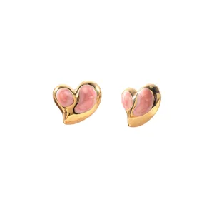 Close-up detail of chic asymmetric heart-shaped titanium steel earrings with pink enamel finish.