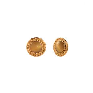 Detailed view of gold stainless steel stud earrings featuring elegant brown cat eye stones.