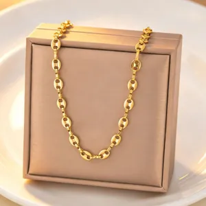 Gold titanium steel coffee bean chain necklace detailed view, elegant minimalist jewelry showcase.