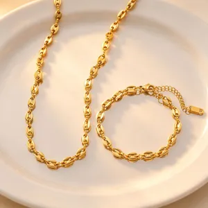 Gold coffee bean chain necklace and bracelet jewelry set, minimalist titanium steel detail.