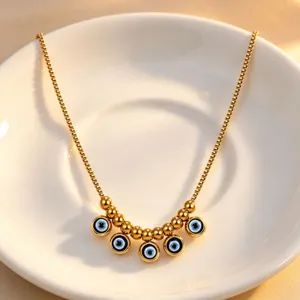 Gold stainless steel evil eye pendant box chain necklace detailed view, minimalist daily chic jewelry.