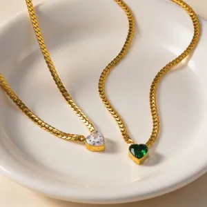 Gold-tone stainless steel heart pendant necklace set featuring clear and green cubic zirconia stones.