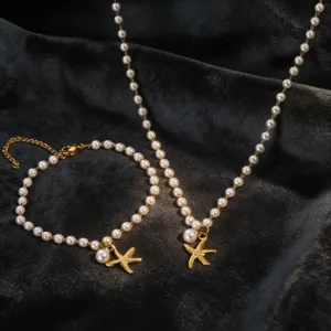 Pearl starfish necklace bracelet set, delicate beach vacation jewelry details for women.