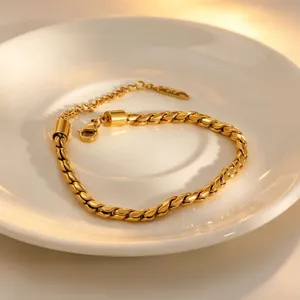 Gold twist chain bracelet detail view, elegant titanium steel jewelry design for daily fashion wear.