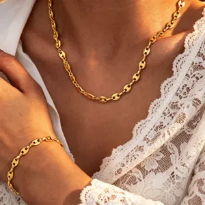 Gold coffee bean chain necklace detail, minimalist titanium steel jewelry design closeup.