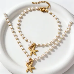 Gold starfish pearl double layer necklace detail shot, elegant beach vacation jewelry style.