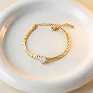 Chic gold titanium steel bracelet featuring a sparkly light blue heart zircon crystal.