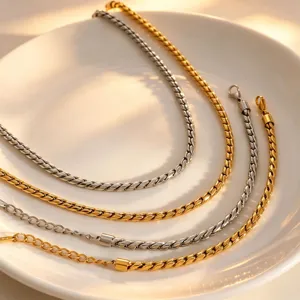 Detailed close-up shot of trendy titanium steel twist chain jewelry set in gold and silver.