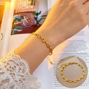 Elegant gold titanium steel coffee bean chain bracelet for women, minimalist daily luxury wrist jewelry.