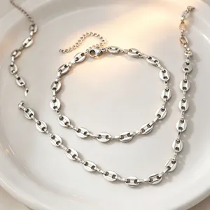 Exquisite titanium steel coffee bean chain necklace and bracelet set, elegant minimal design.