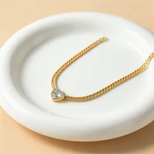 Gold-plated heart zircon pendant necklace detail view, elegant clavicle chain jewelry.