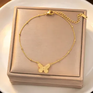 Gold titanium steel butterfly pendant clavicle chain necklace close-up view, delicate bead details.
