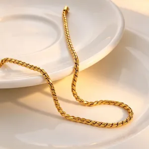 Close-up detail of the elegant gold rope chain showing exquisite metallic texture and finish.